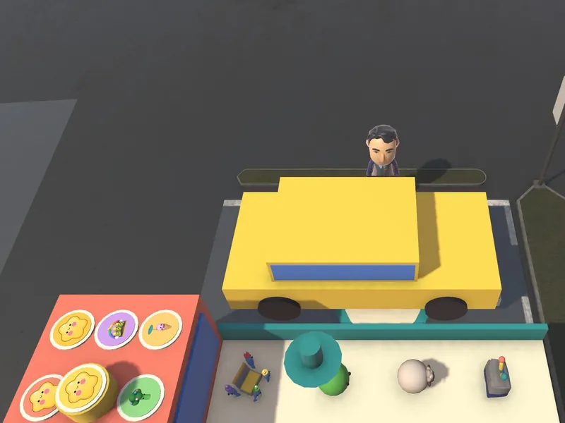 The yellow truck at home, next to the shelf of collected products